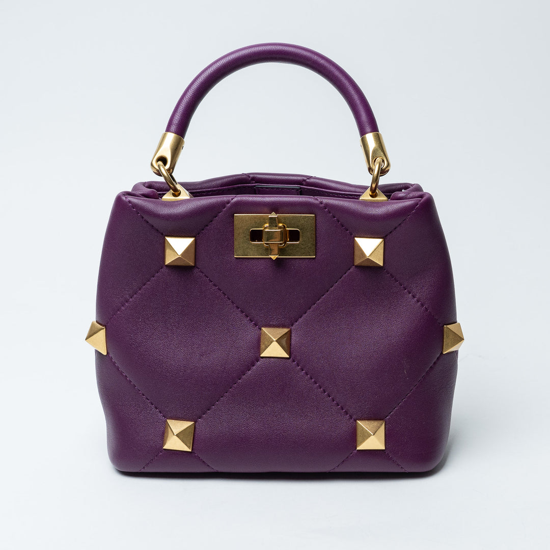 Purple Quilted Nappa Leather Roman Stud Top Handle Bag. (front)
