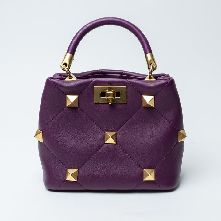Purple Quilted Nappa Leather Roman Stud Top Handle Bag. (front)