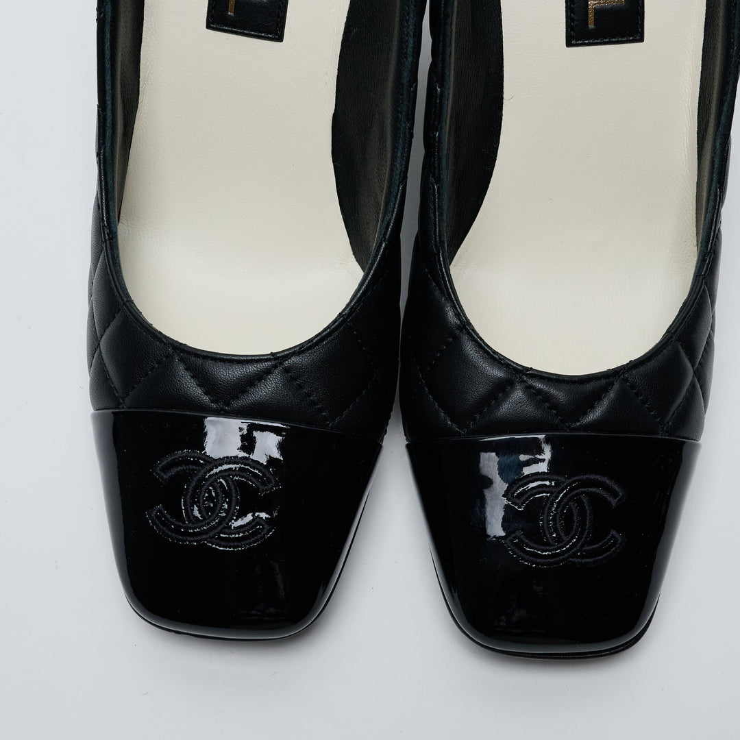 Black Quilted Lambskin Leather Cap Toe Pumps. (view 3)