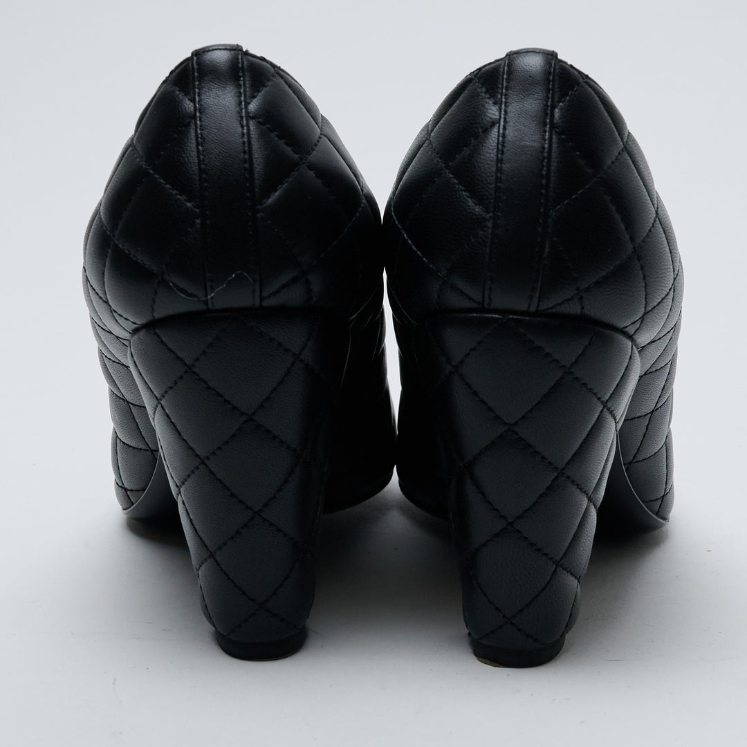 Black Quilted Lambskin Leather Cap Toe Pumps. (view 5)