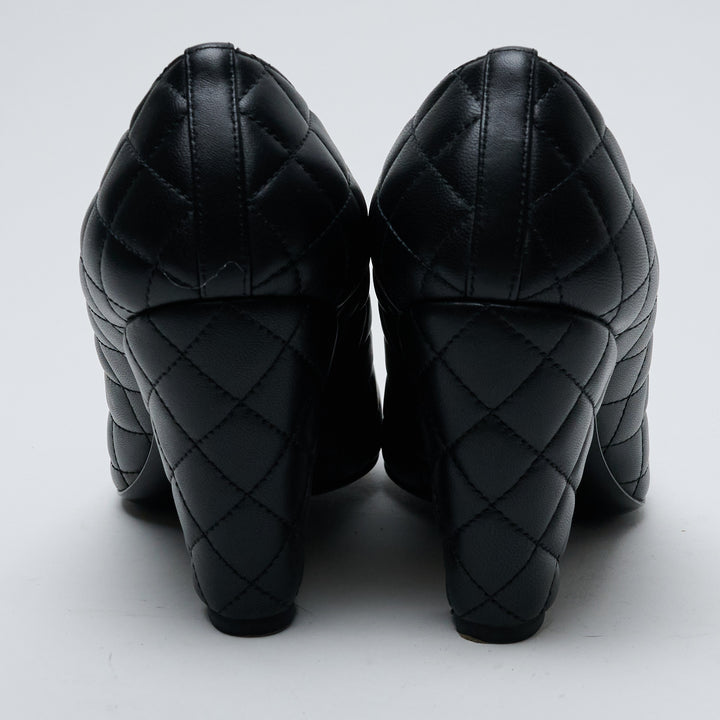 Black Quilted Lambskin Leather Cap Toe Pumps. (view 5)