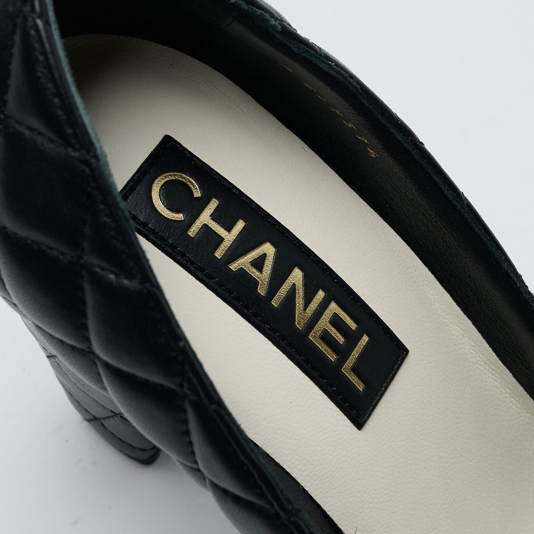 Black Quilted Lambskin Leather Cap Toe Pumps. (view 8)
