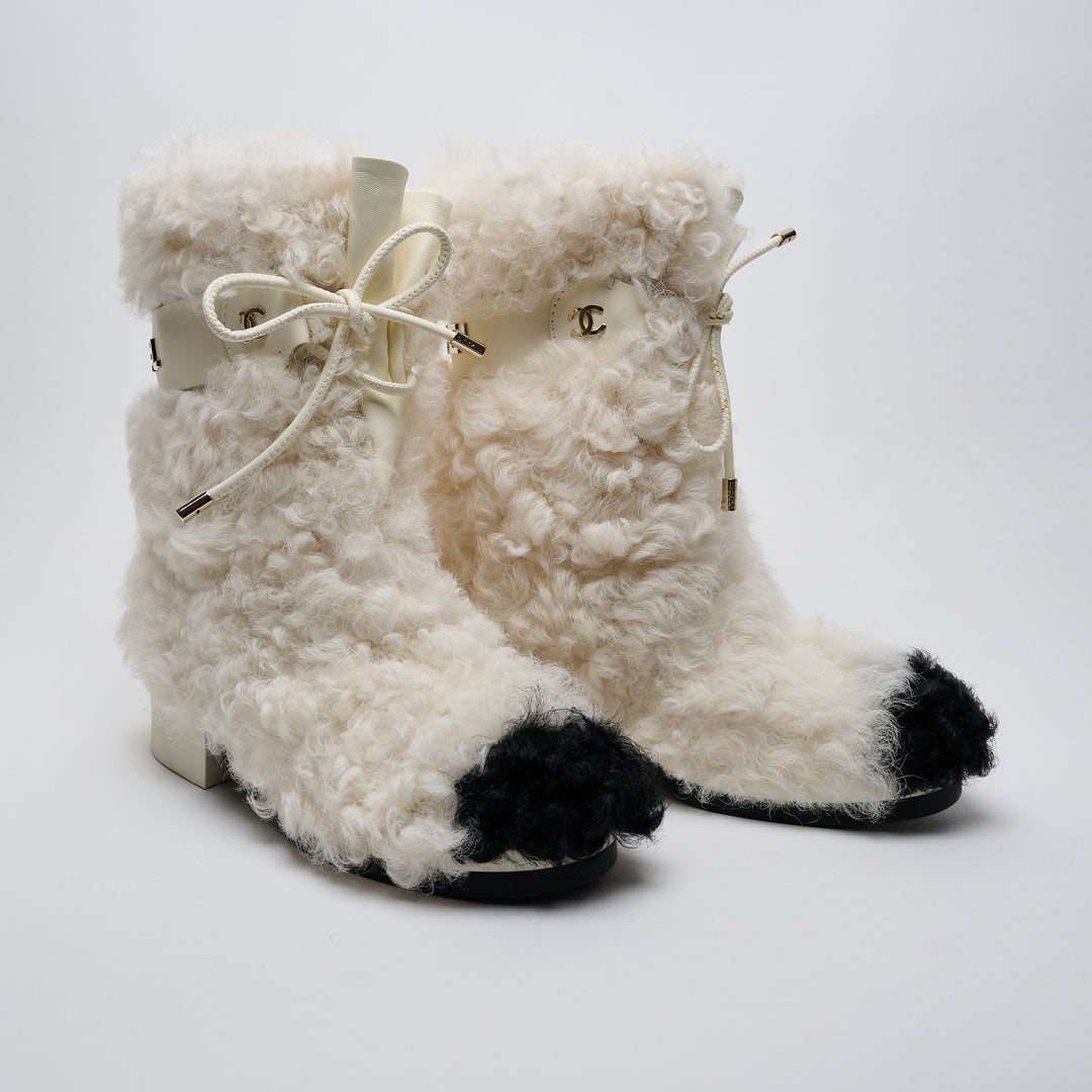 Ivory Shearling Lace-Up Boots. (front)