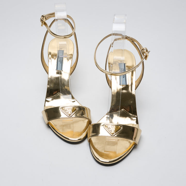 Gold Metallic Leather Ankle Strap Sandals. (front)