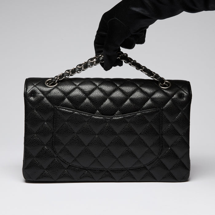 Pre-Loved Chanel ™ Black Pebbled Leather Medium Double Flap Bag with Silver Hardware