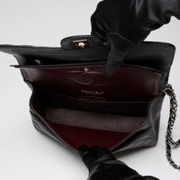 Pre-Loved Chanel ™ Black Pebbled Leather Medium Double Flap Bag