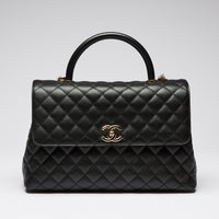 Pre-Loved Chanel™ Black Pebbled Leather Flap Bag with Top Handle