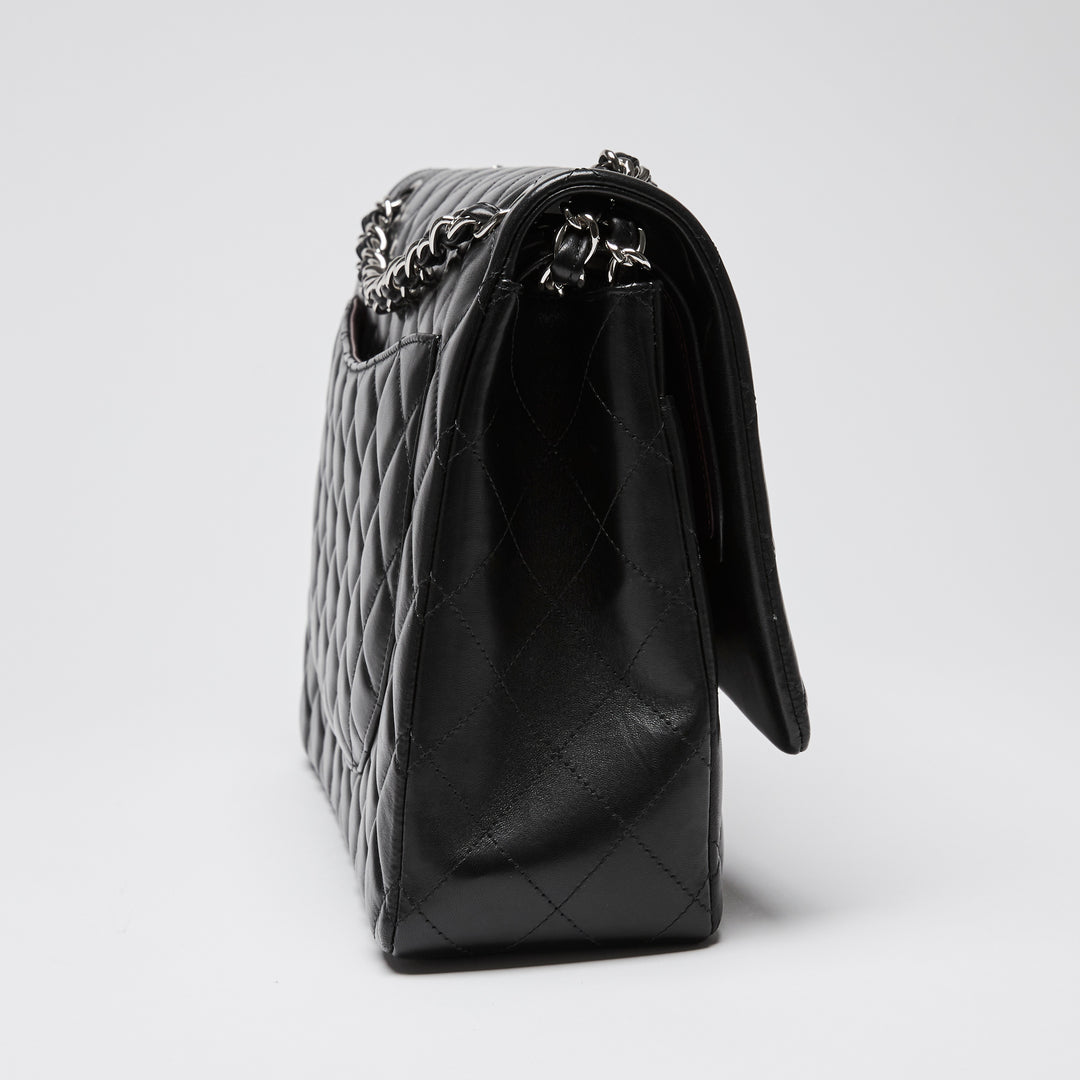 Pre-Loved Chanel™ Black Quilted Lambskin Leather Maxi Classic Double Flap Bag