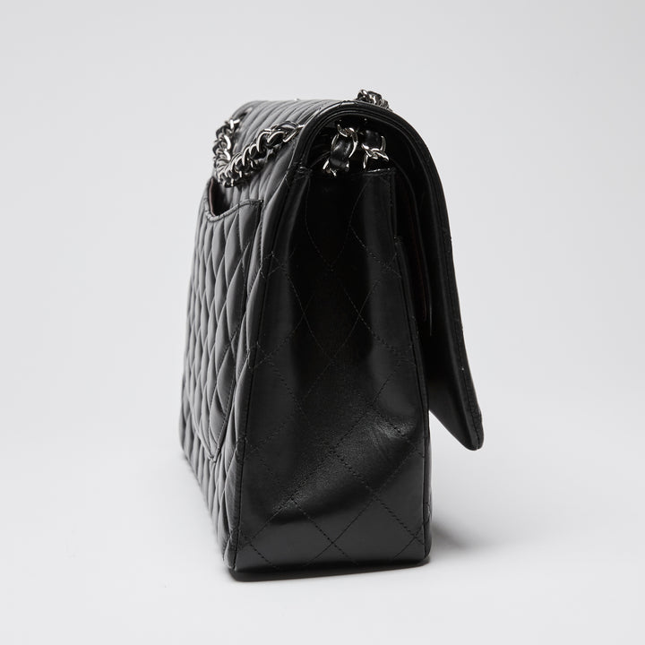 Pre-Loved Chanel™ Black Quilted Lambskin Leather Maxi Classic Double Flap Bag