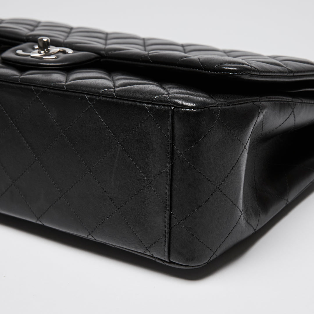 Pre-Loved Chanel™ Black Quilted Lambskin Leather Maxi Classic Double Flap Bag