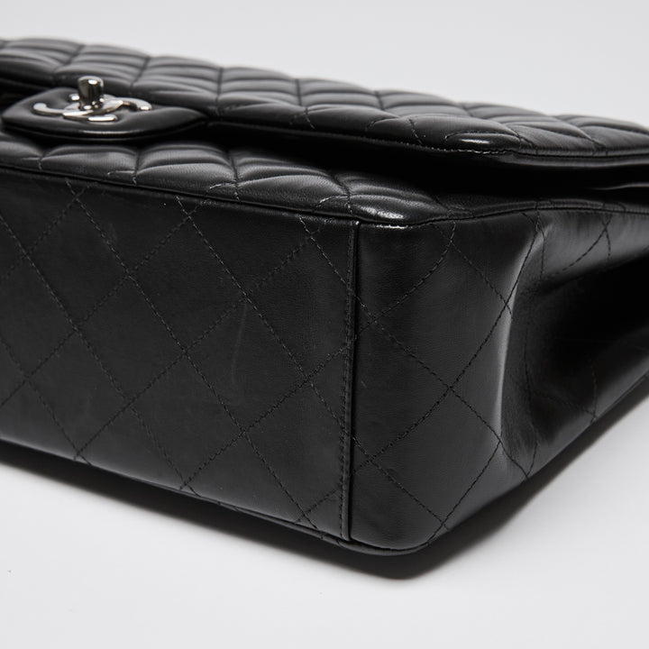 Pre-Loved Chanel™ Black Quilted Lambskin Leather Maxi Classic Double Flap Bag