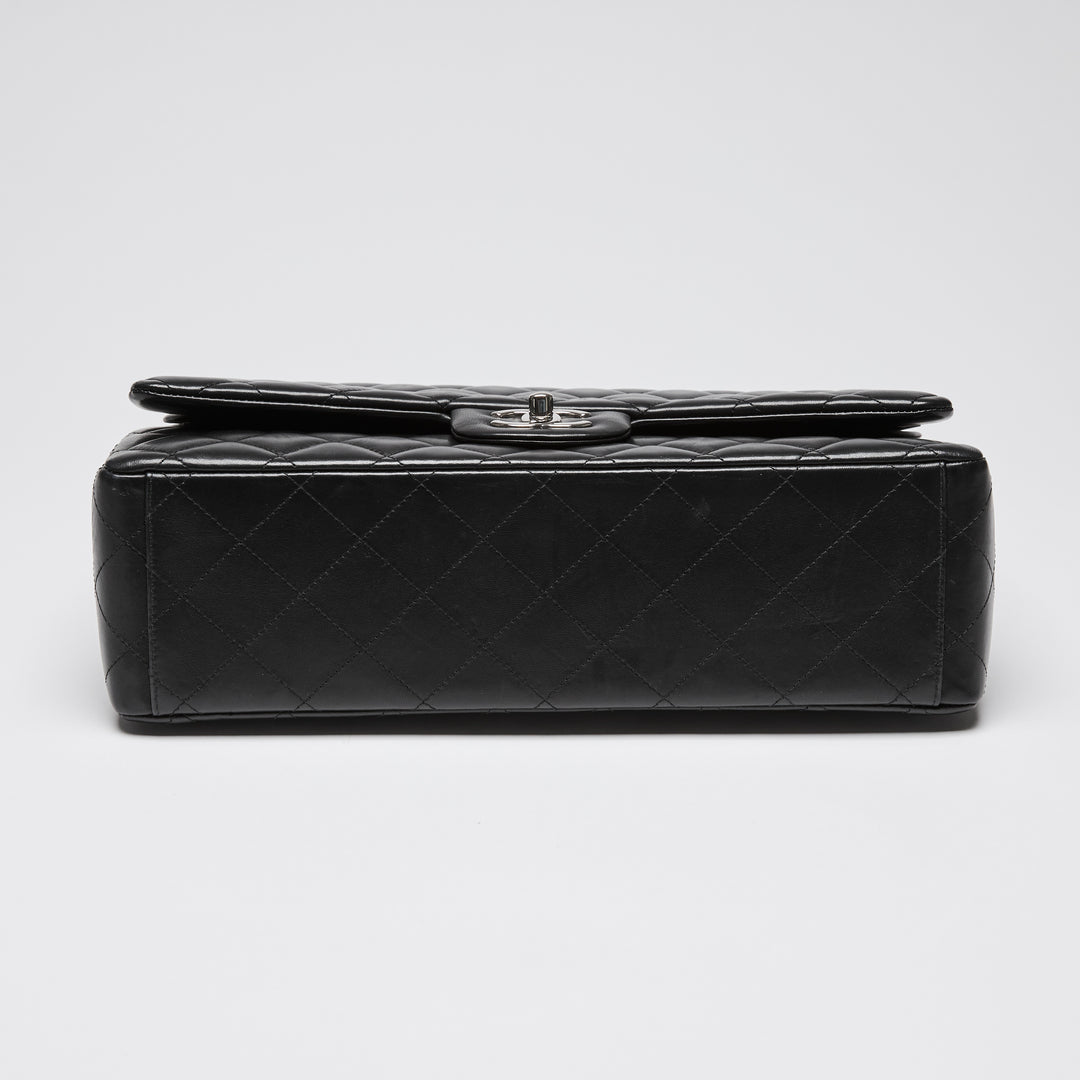 Pre-Loved Chanel™ Black Quilted Lambskin Leather Maxi Classic Double Flap Bag