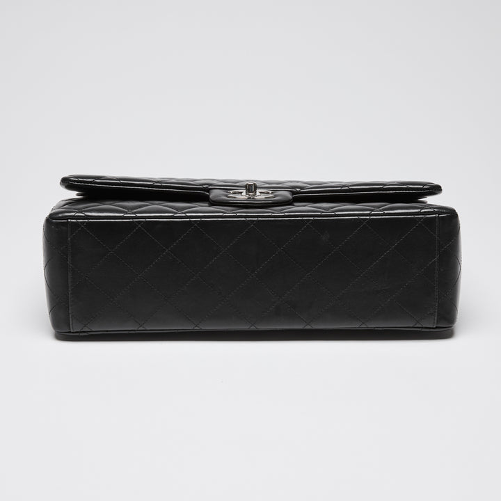 Pre-Loved Chanel™ Black Quilted Lambskin Leather Maxi Classic Double Flap Bag