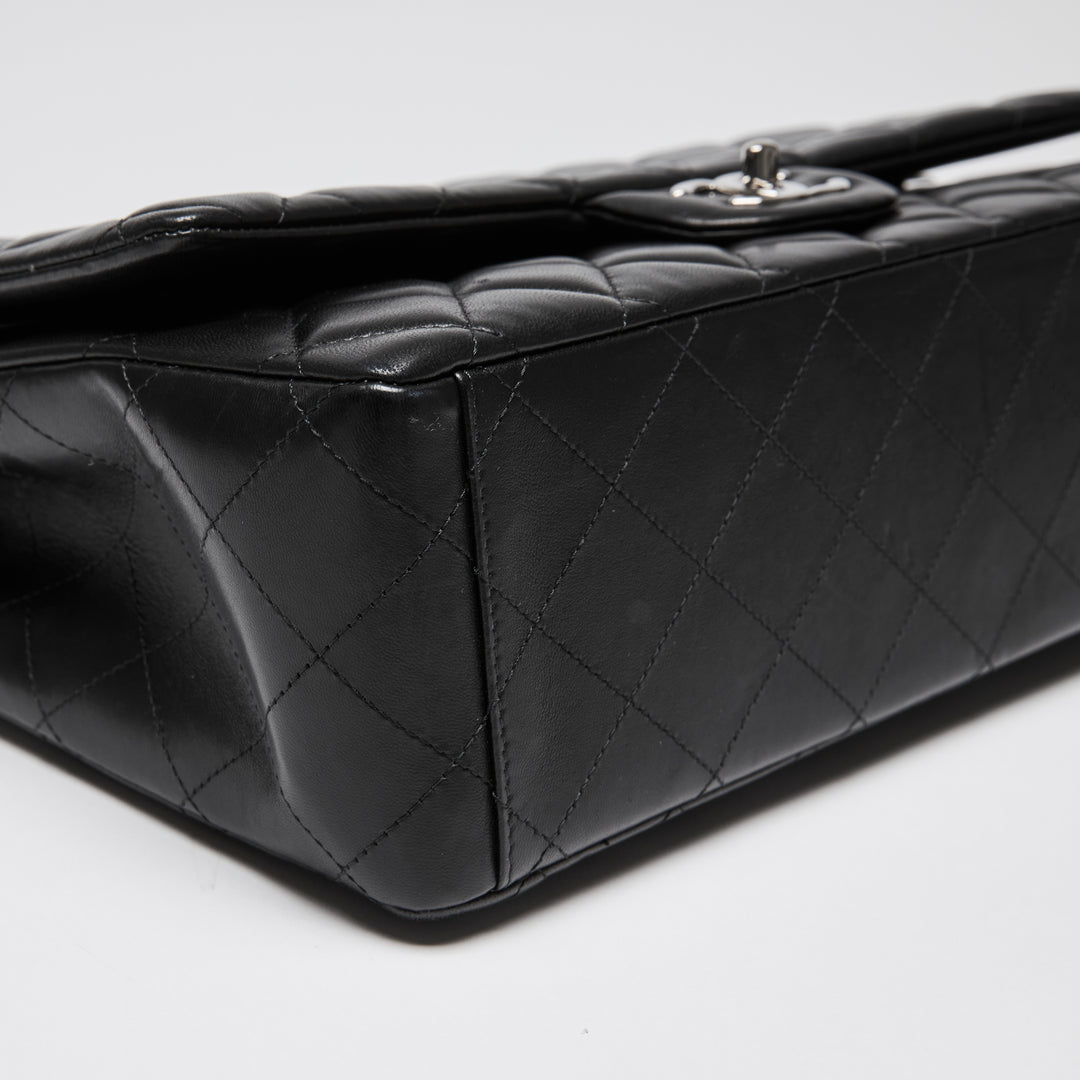 Pre-Loved Chanel™ Black Quilted Lambskin Leather Maxi Classic Double Flap Bag