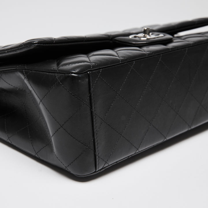 Pre-Loved Chanel™ Black Quilted Lambskin Leather Maxi Classic Double Flap Bag