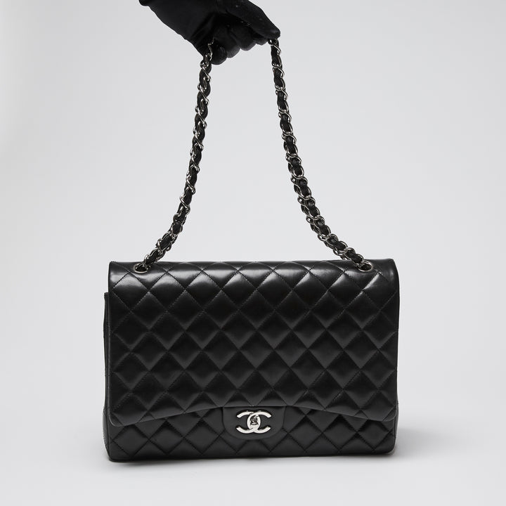 Pre-Loved Chanel™ Black Quilted Lambskin Leather Maxi Classic Double Flap Bag