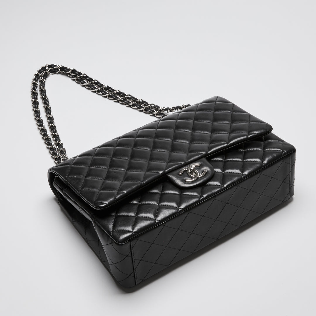 Pre-Loved Chanel™ Black Quilted Lambskin Leather Maxi Classic Double Flap Bag