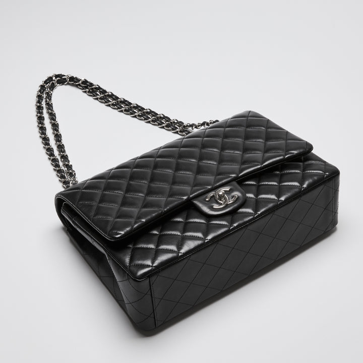 Pre-Loved Chanel™ Black Quilted Lambskin Leather Maxi Classic Double Flap Bag