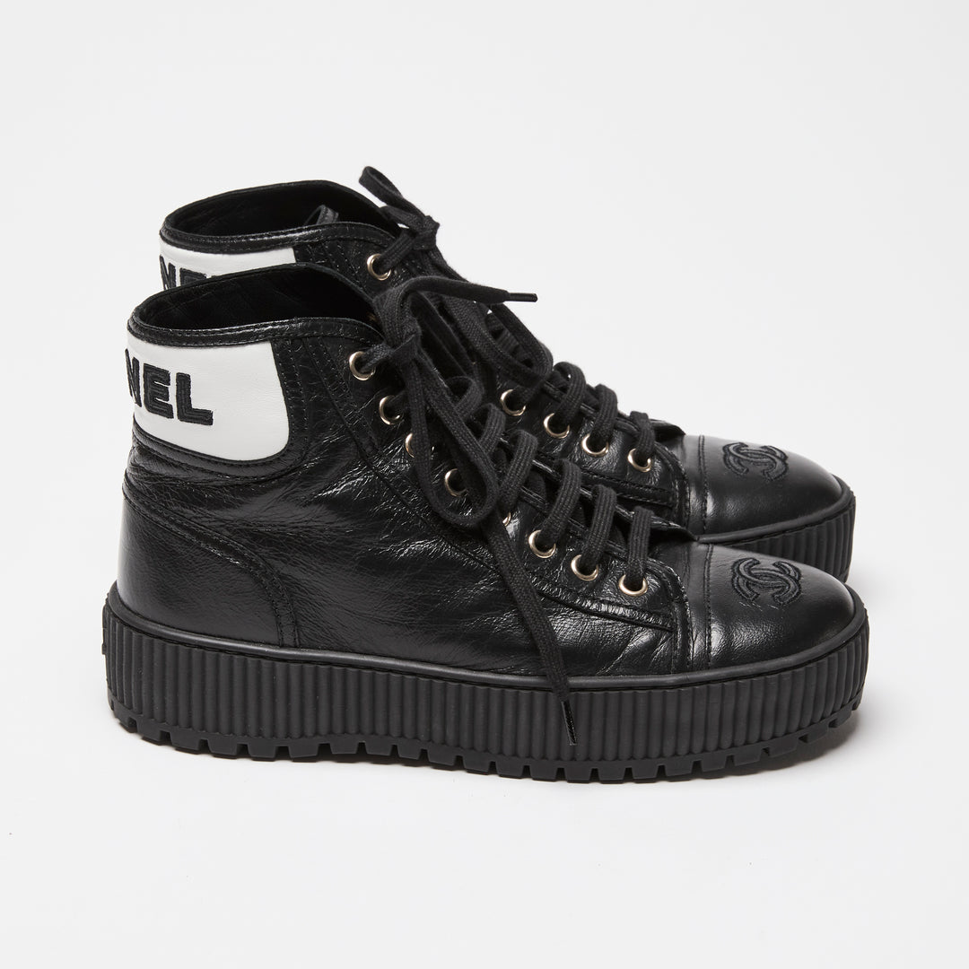 Pre-Loved Chanel™ Black Calfskin Leather High Top Sneakers Size 36C