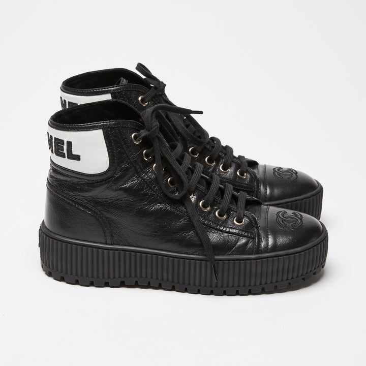 Pre-Loved Chanel™ Black Calfskin Leather High Top Sneakers Size 36C
