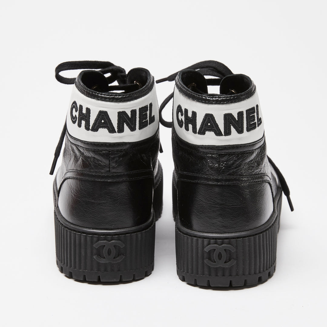 Pre-Loved Chanel™ Black Calfskin Leather High Top Sneakers Size 36C