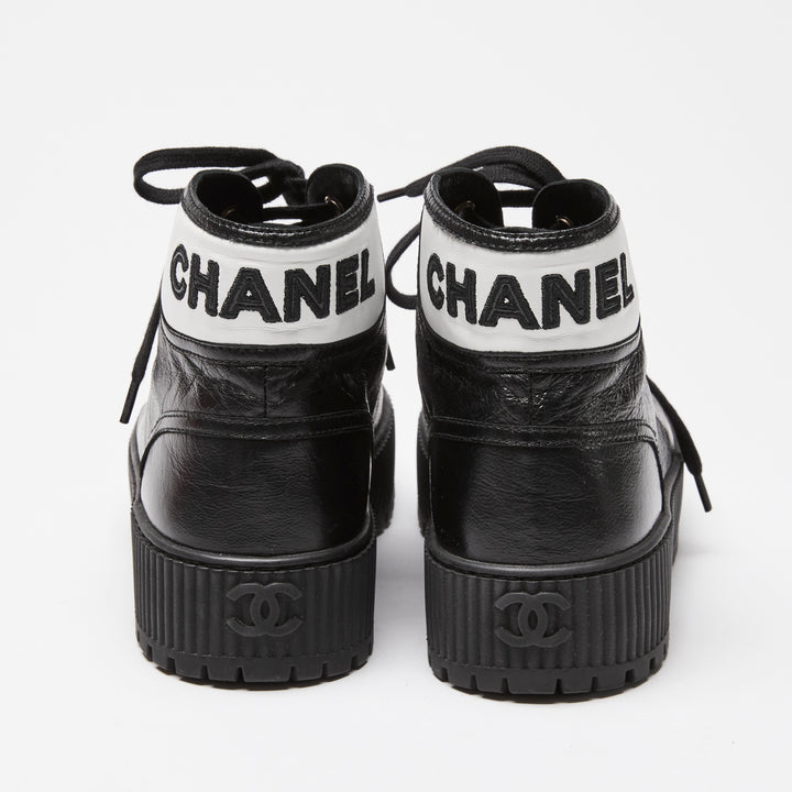 Pre-Loved Chanel™ Black Calfskin Leather High Top Sneakers Size 36C
