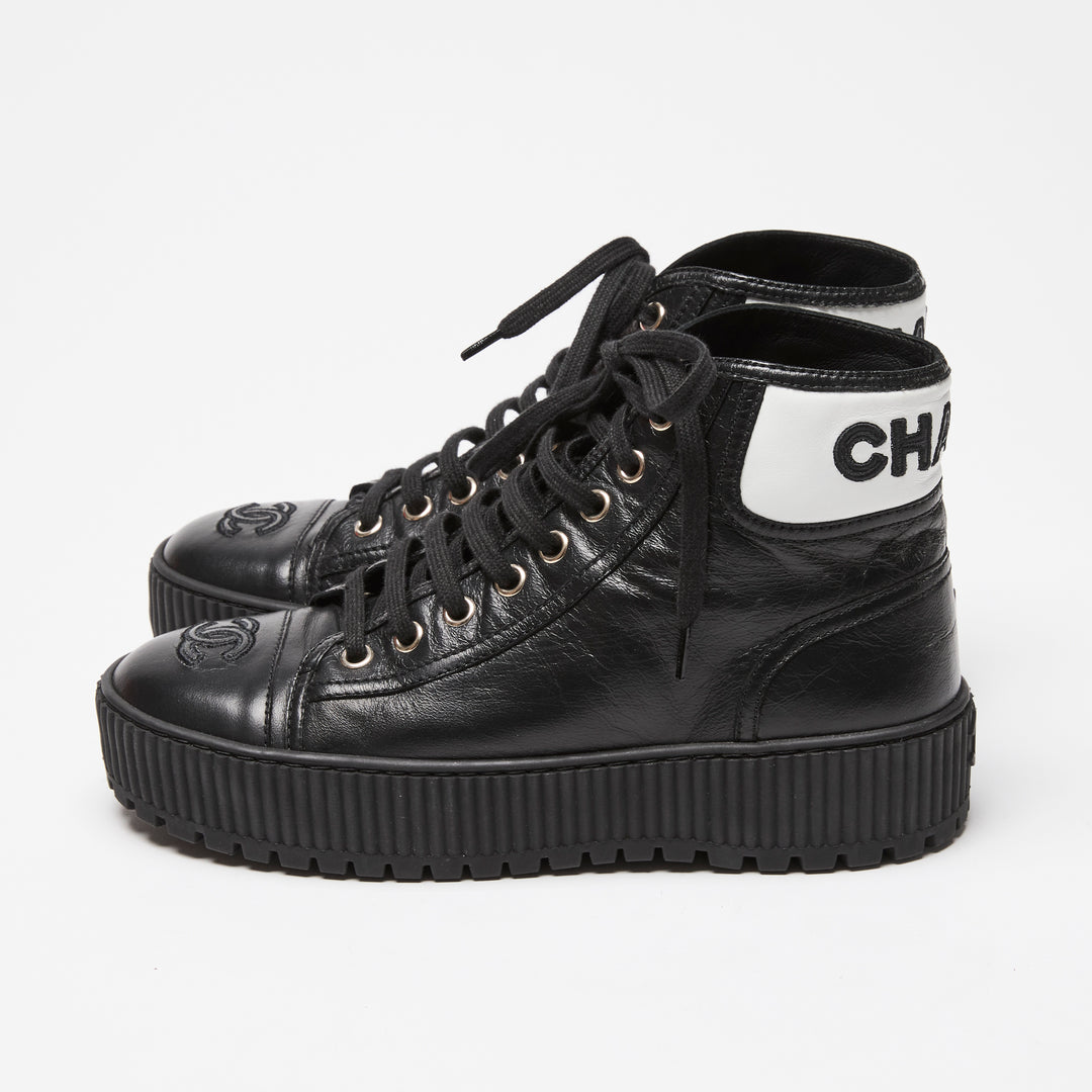Pre-Loved Chanel™ Black Calfskin Leather High Top Sneakers Size 36C