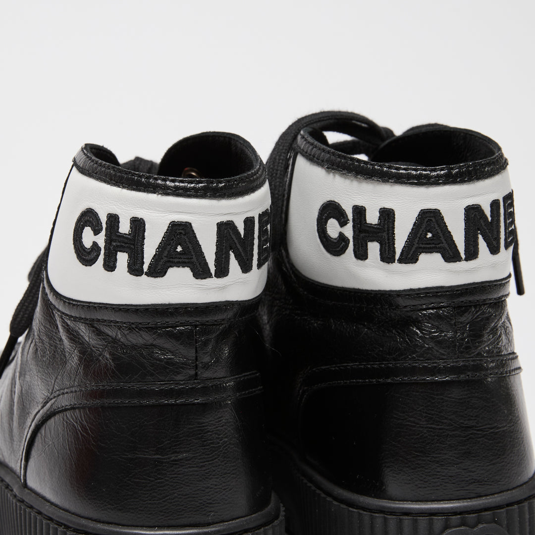 Pre-Loved Chanel™ Black Calfskin Leather High Top Sneakers Size 36C