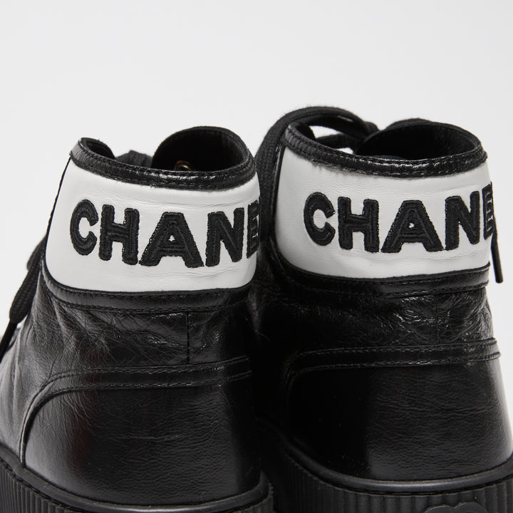 Pre-Loved Chanel™ Black Calfskin Leather High Top Sneakers Size 36C