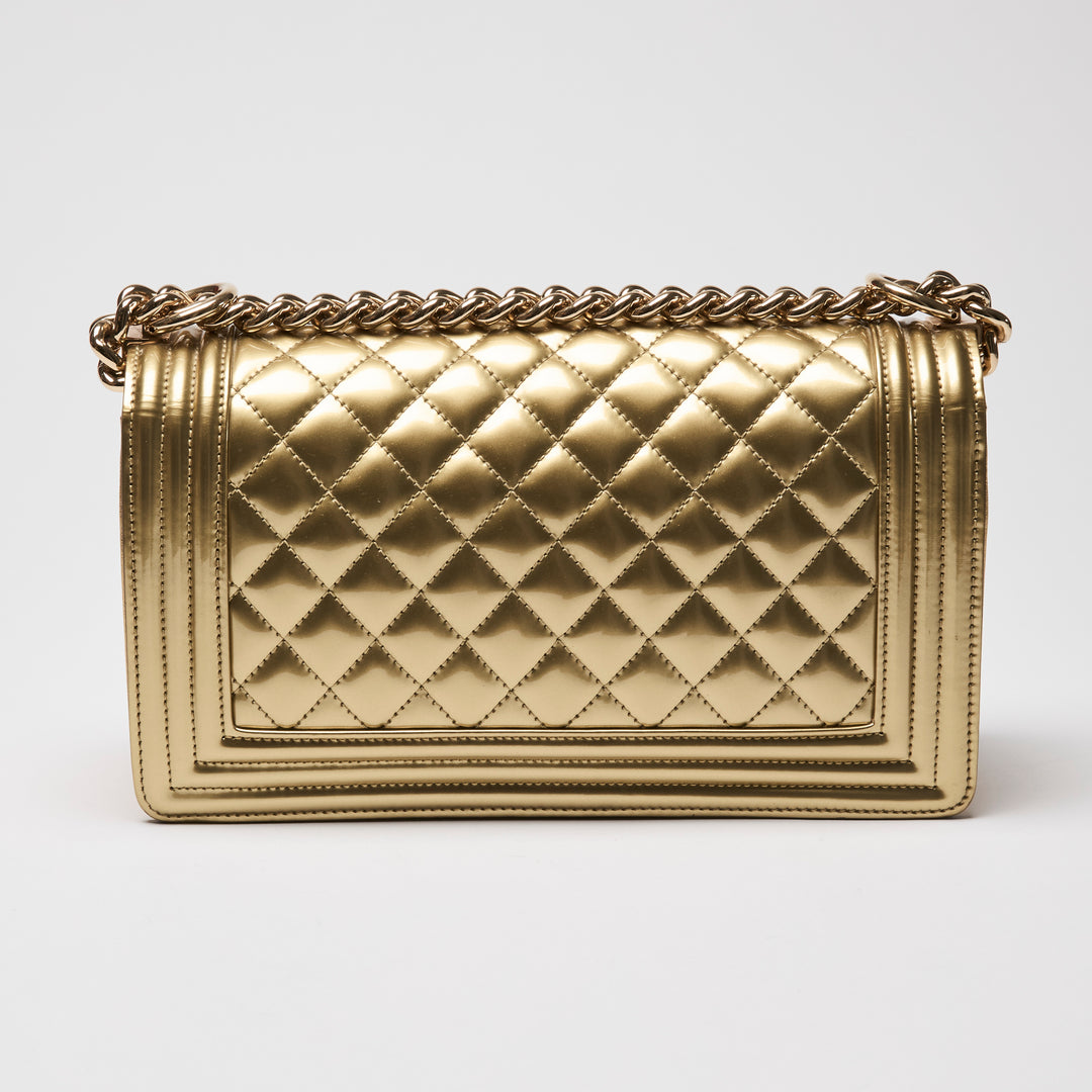 Pre-Loved Chanel™ Gold Patent Leather Medium Boy Bag
