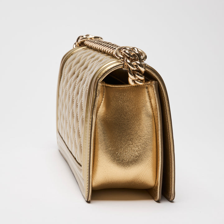 Pre-Loved Chanel™ Gold Patent Leather Medium Boy Bag