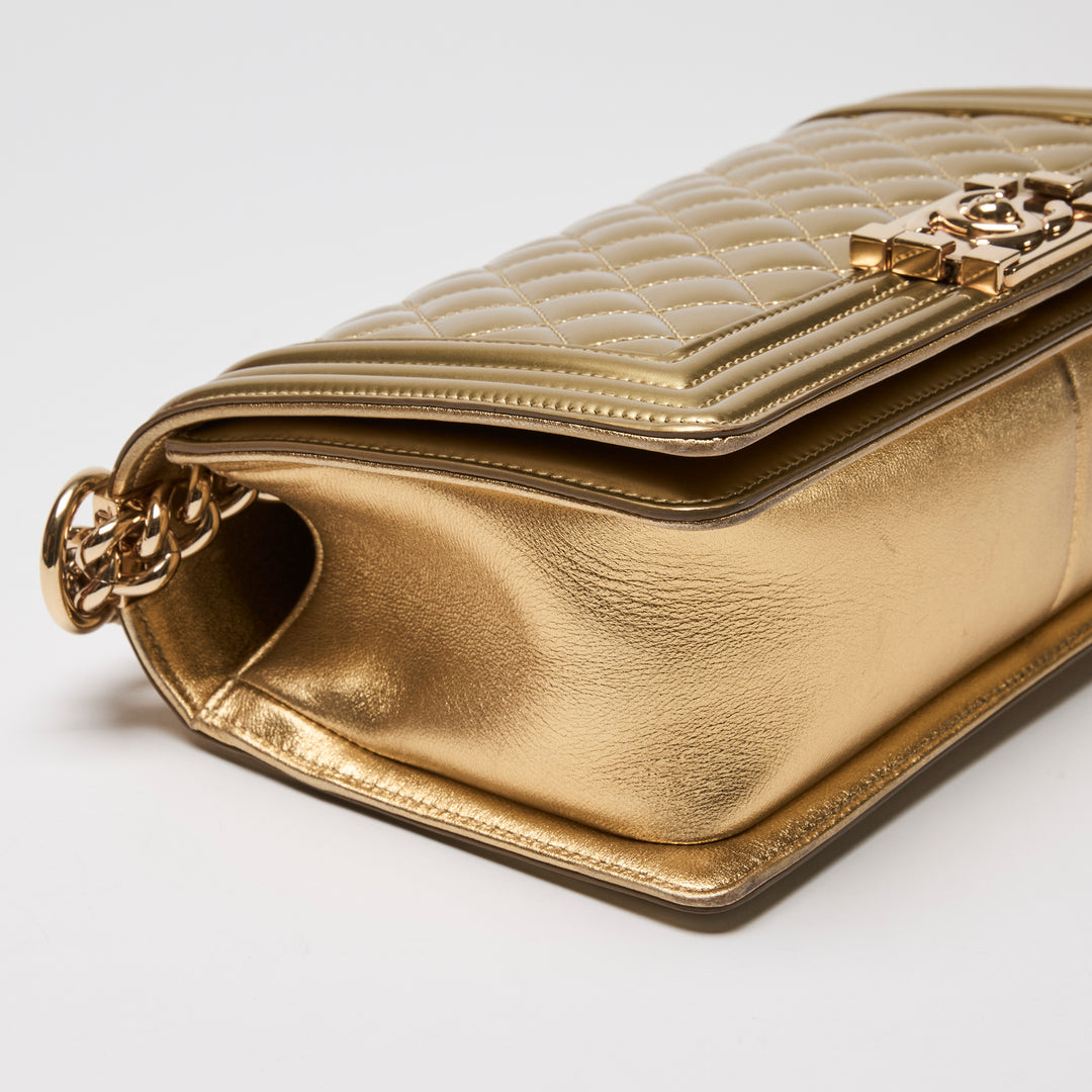 Pre-Loved Chanel™ Gold Patent Leather Medium Boy Bag