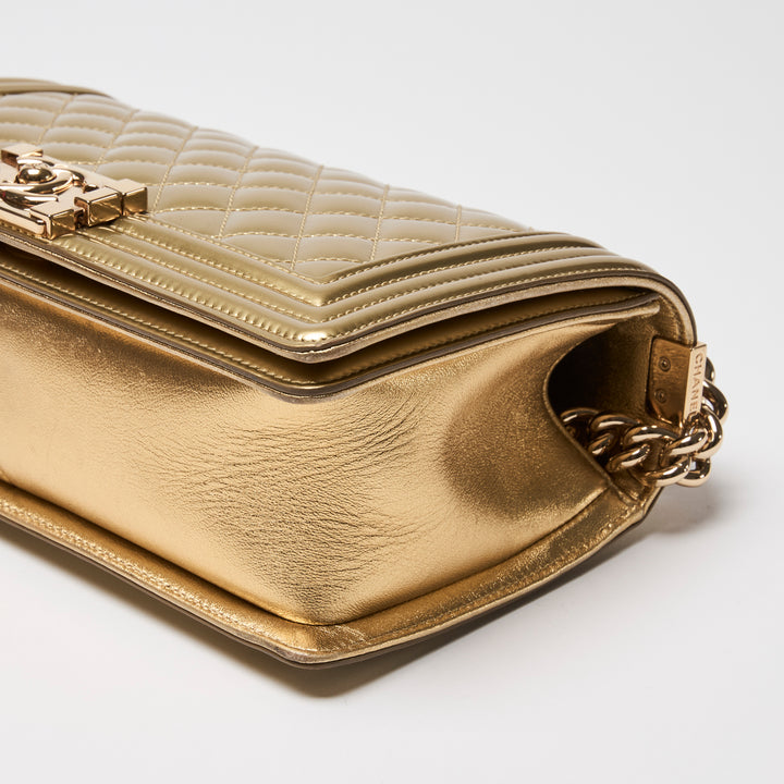 Pre-Loved Chanel™ Gold Patent Leather Medium Boy Bag