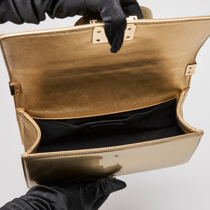 Pre-Loved Chanel™ Gold Patent Leather Medium Boy Bag