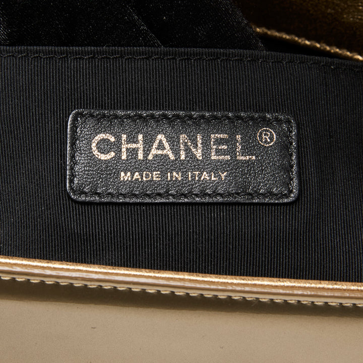Pre-Loved Chanel™ Gold Patent Leather Medium Boy Bag
