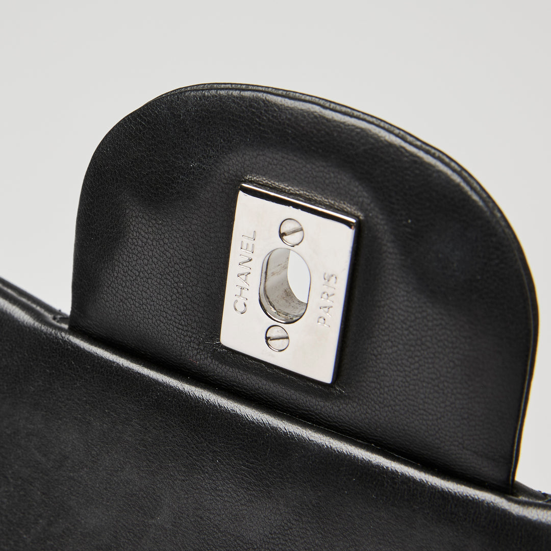 Pre-Loved Chanel™ Black Quilted Lambskin Leather Maxi Classic Double Flap Bag