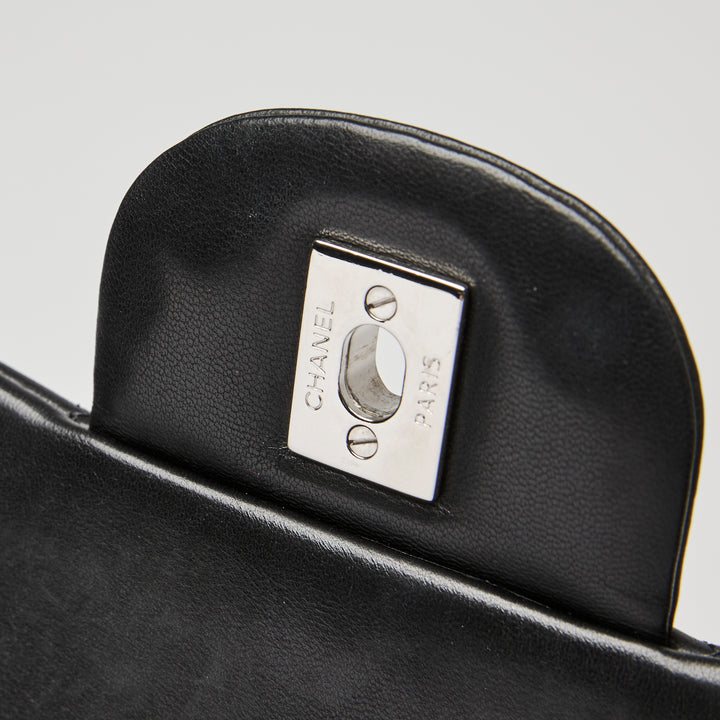 Pre-Loved Chanel™ Black Quilted Lambskin Leather Maxi Classic Double Flap Bag