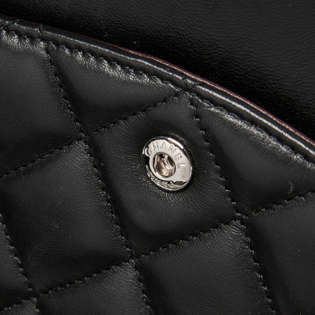 Pre-Loved Chanel™ Black Quilted Lambskin Leather Maxi Classic Double Flap Bag