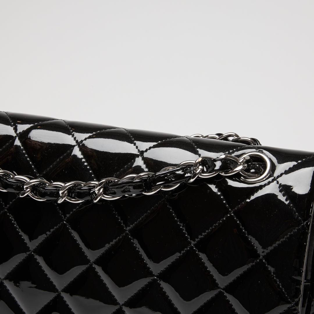 Pre-Loved Chanel™ Black Patent Leather Maxi Classic Double Flap Bag