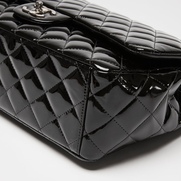 Pre-Loved Chanel™ Black Patent Leather Maxi Classic Double Flap Bag