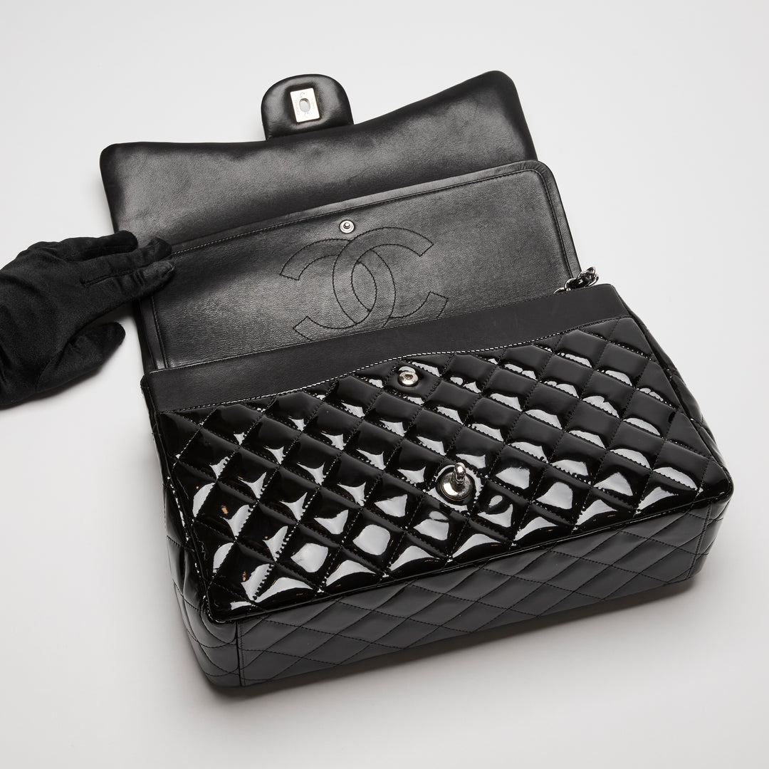 Pre-Loved Chanel™ Black Patent Leather Maxi Classic Double Flap Bag
