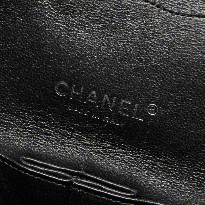 Pre-Loved Chanel™ Black Patent Leather Maxi Classic Double Flap Bag