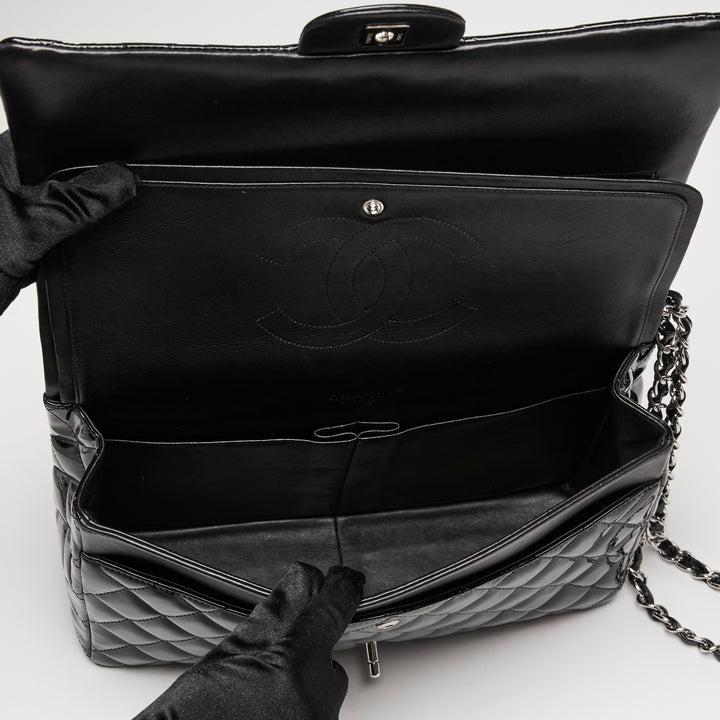 Pre-Loved Chanel™ Black Patent Leather Maxi Classic Double Flap Bag