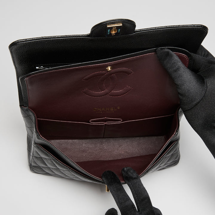 Pre-Loved Chanel™ Black Caviar Leather Medium Classic Double Flap