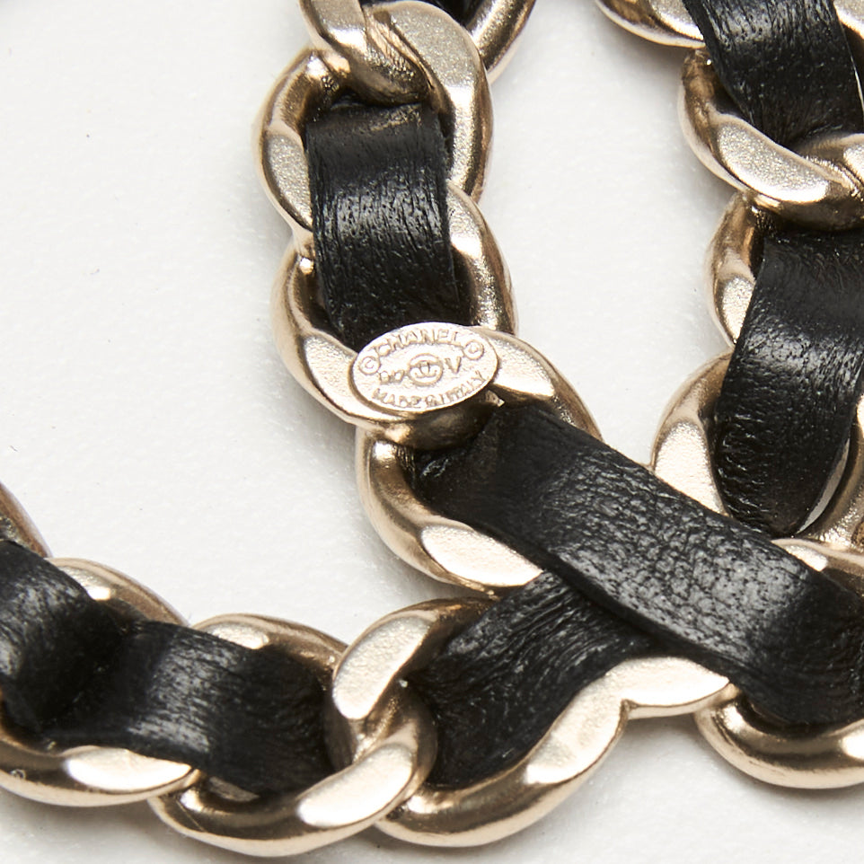 Pre-Loved Chanel™ Gold-Tone Interlaced Black Calf Leather Logo Brooch