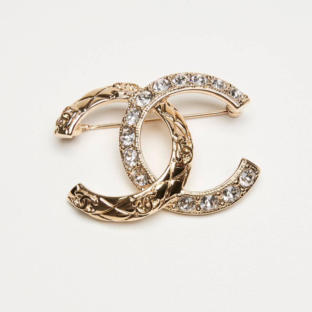 Pre-Loved Chanel™ Gold-Tone Interlaced Black Calf Leather Logo Brooch