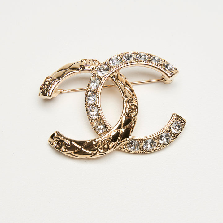 Pre-Loved Chanel™ Gold-Tone Interlaced Black Calf Leather Logo Brooch