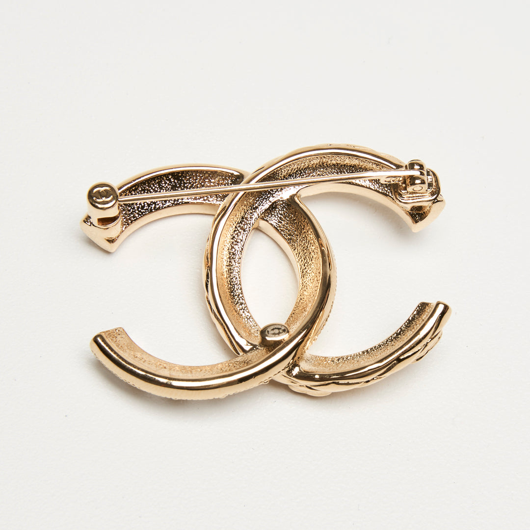 Pre-Loved Chanel™ Gold-Tone Interlaced Black Calf Leather Logo Brooch