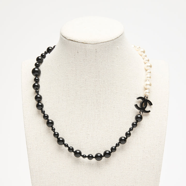 Pre-Loved Chanel™ Black & White Faux Pearl Necklace with Logo Detail