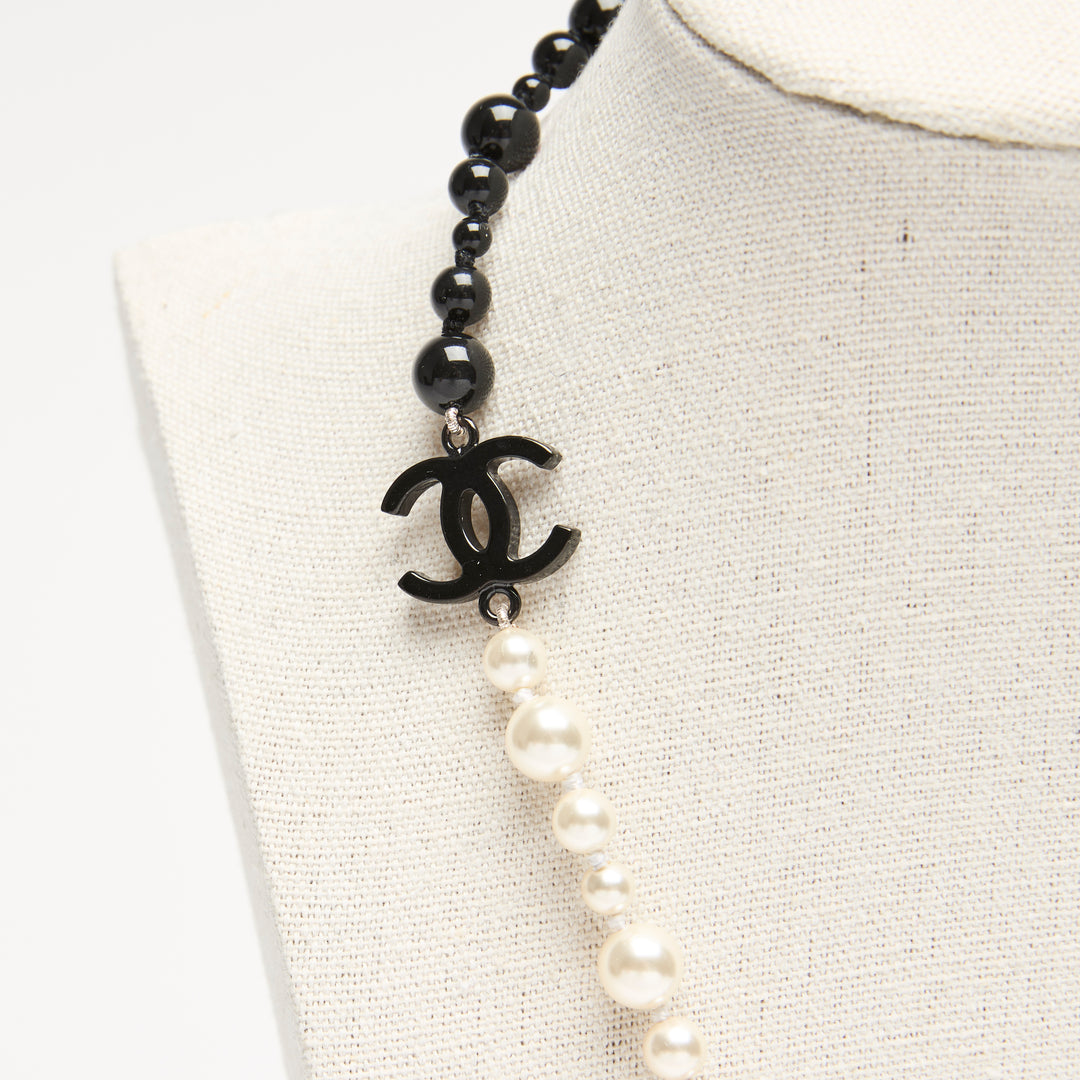 Pre-Loved Chanel™ Black & White Faux Pearl Necklace with Logo Detail